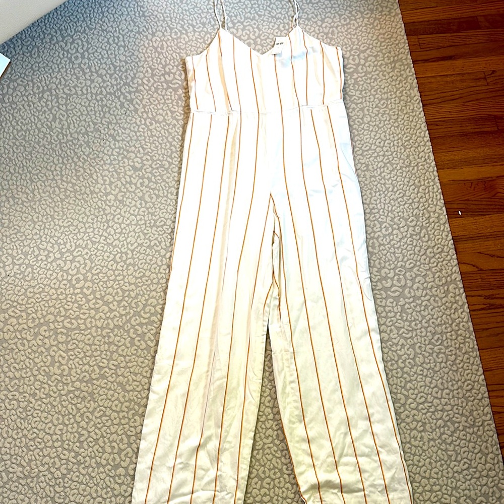 Flattering Anthropologie size 12, jumpsuit cream with orange, yellow stripe